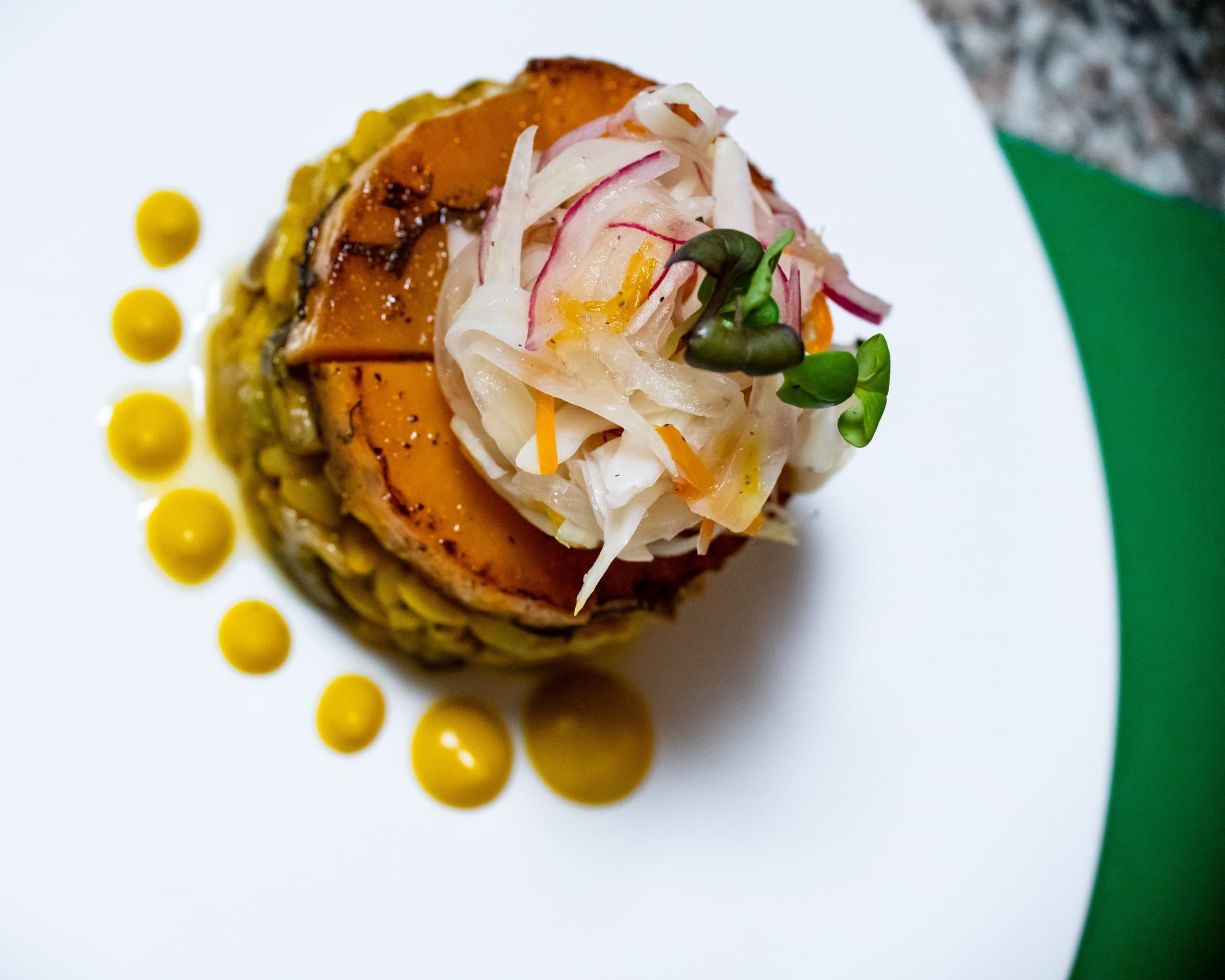 Elevated plated dish by Chef Kriss Kofi
